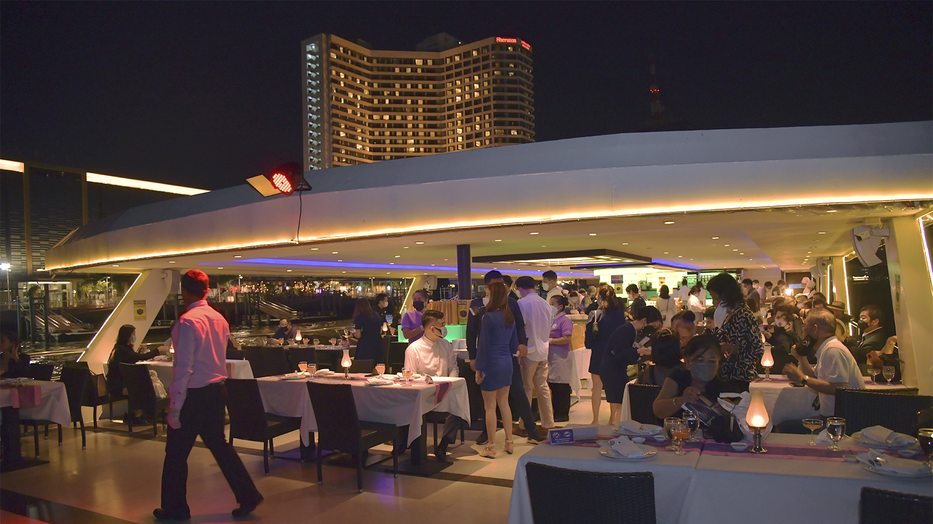 Forex affiliates attending an Exclusive Partnership Dinner in a luxurious double-decker cruise near ICONSIAM